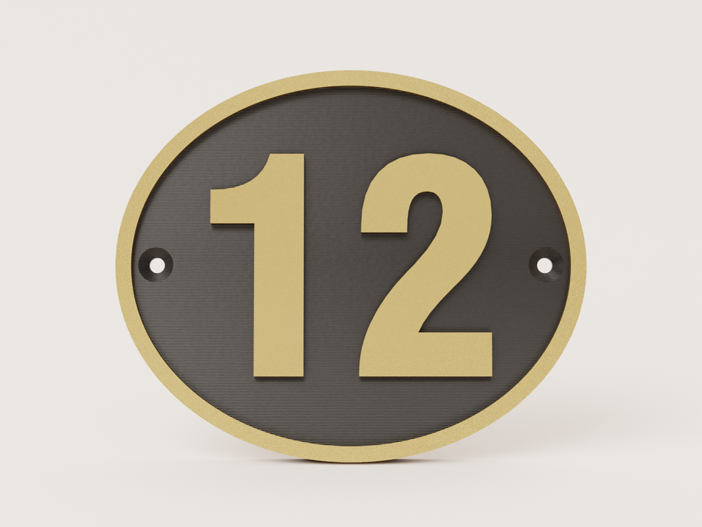 Oval house door number sign in black and gold - number 12 example