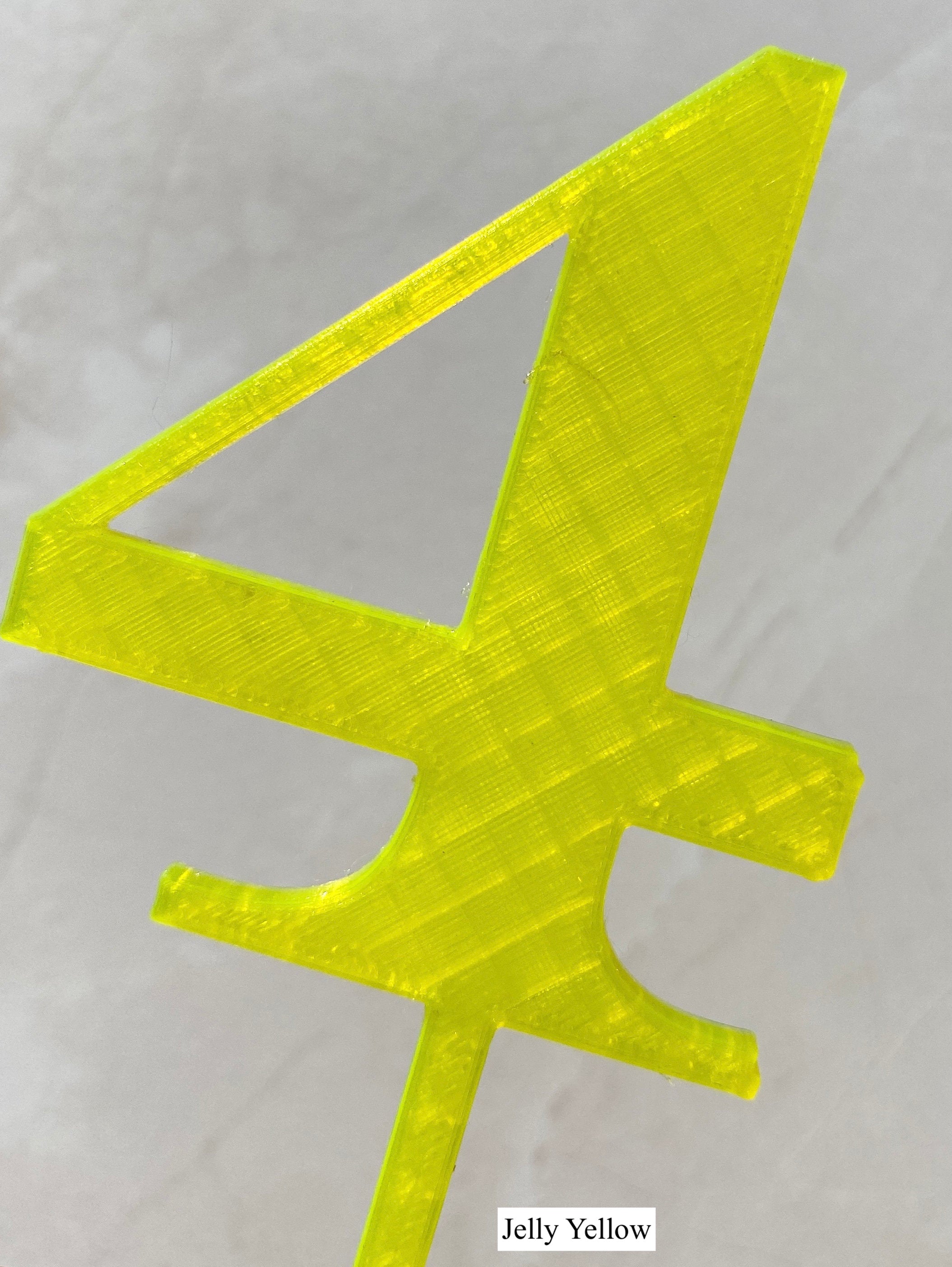 Jelly yellow number 4 cake topper close-up