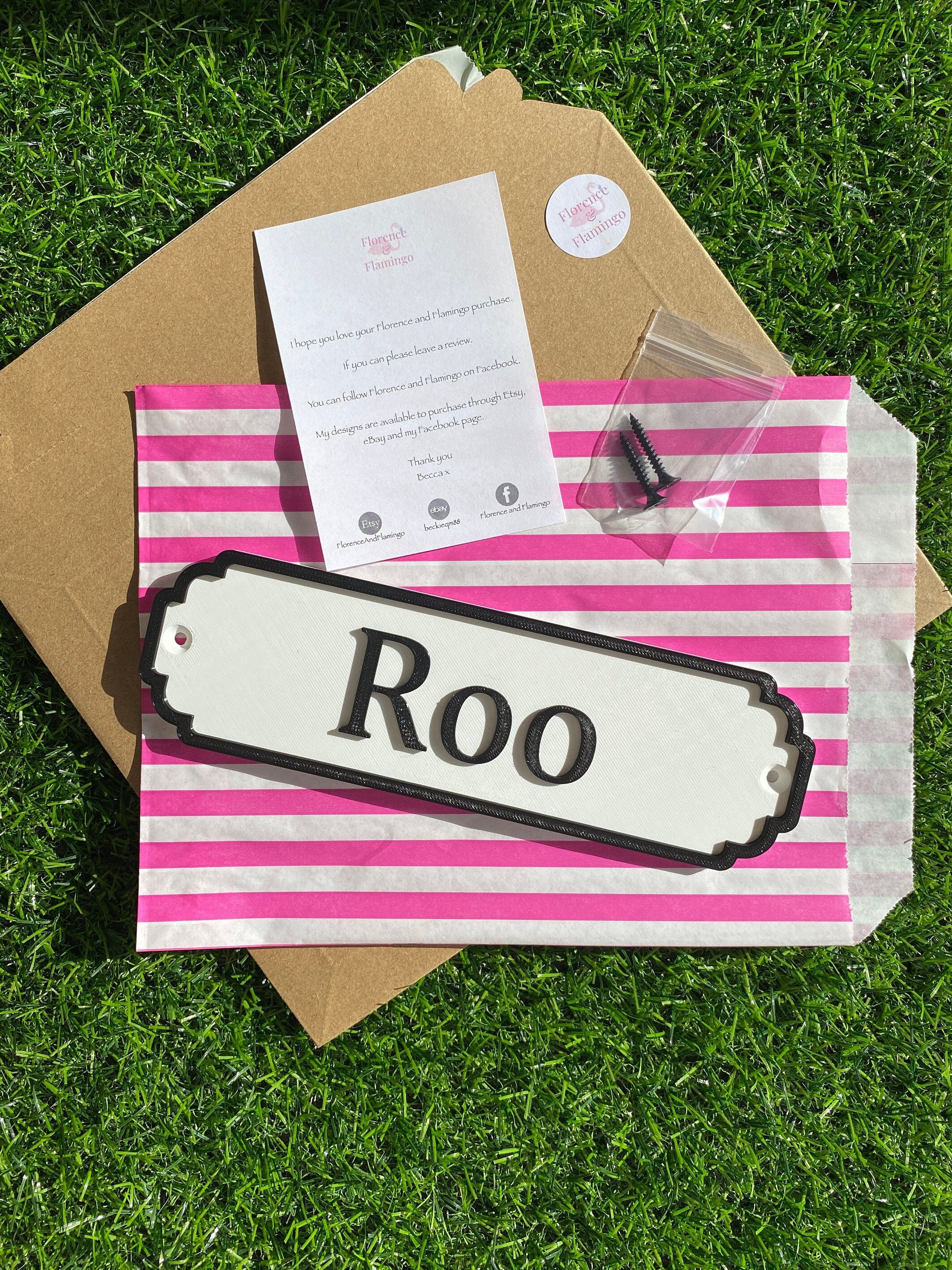 Classic door sign reading Roo with packaging, screws and care card