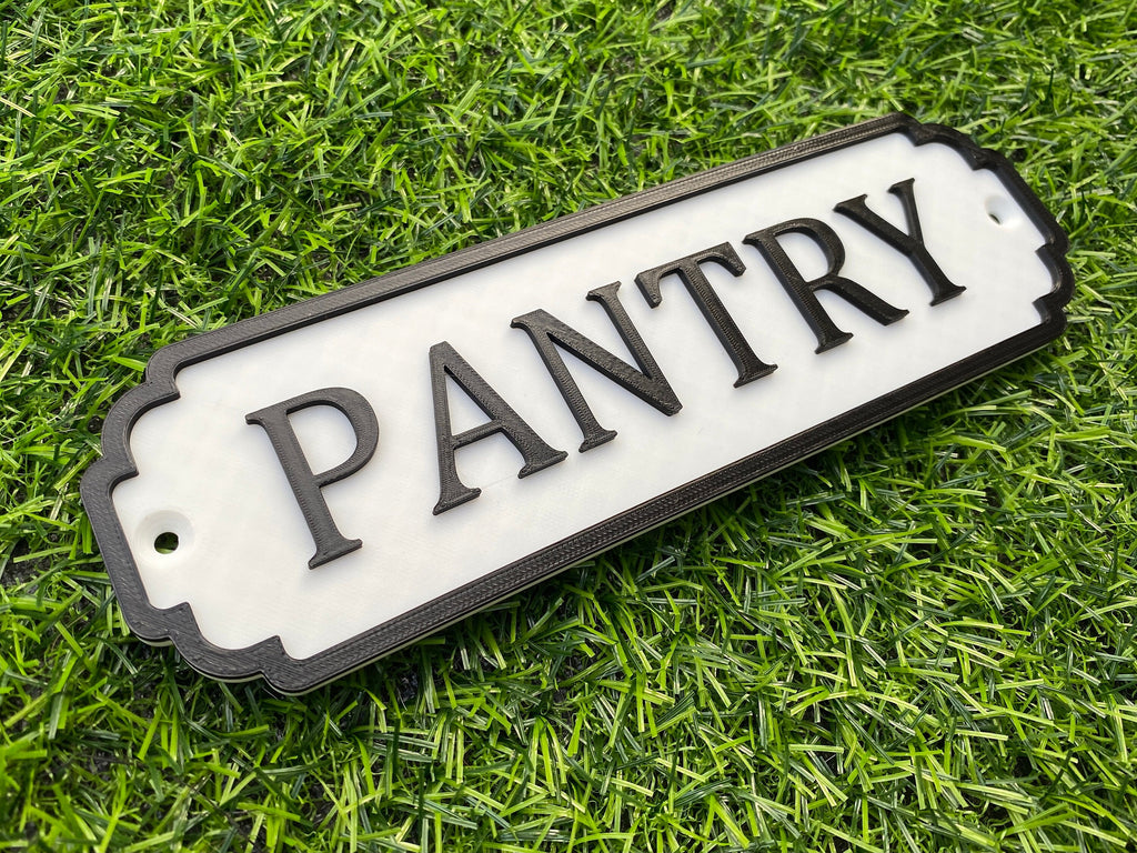 White and black classic door sign reading Pantry