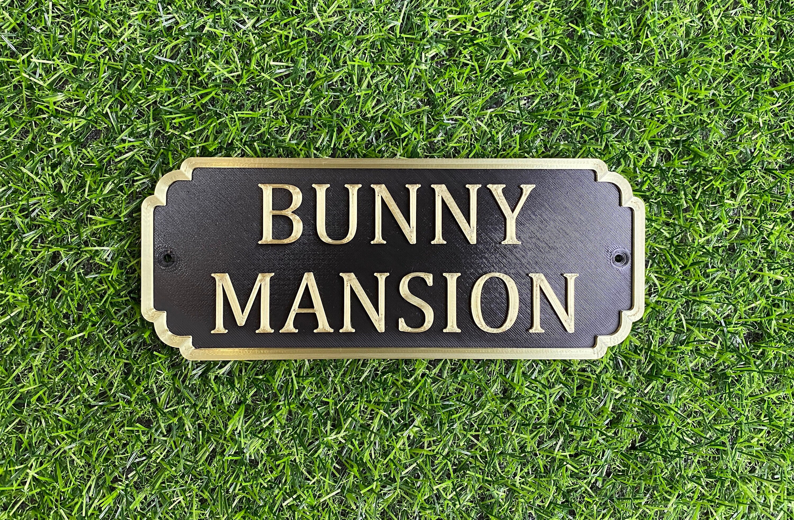 Black and gold rabbit hutch sign reading Bunny Mansion
