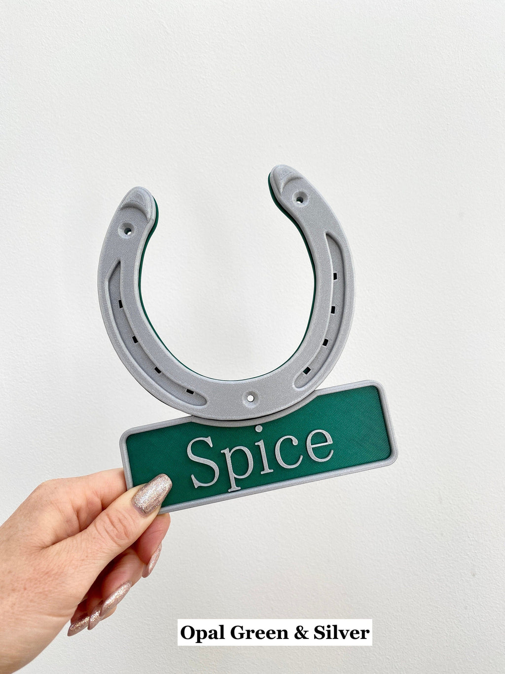 Opal green and silver horseshoe name plate held in hand, name Spice