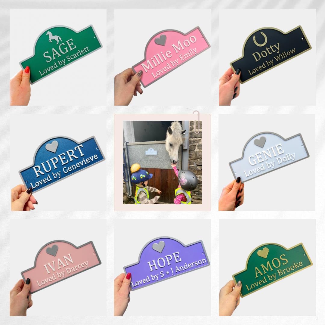 Nine Loved By range signs in different colours held up in hand