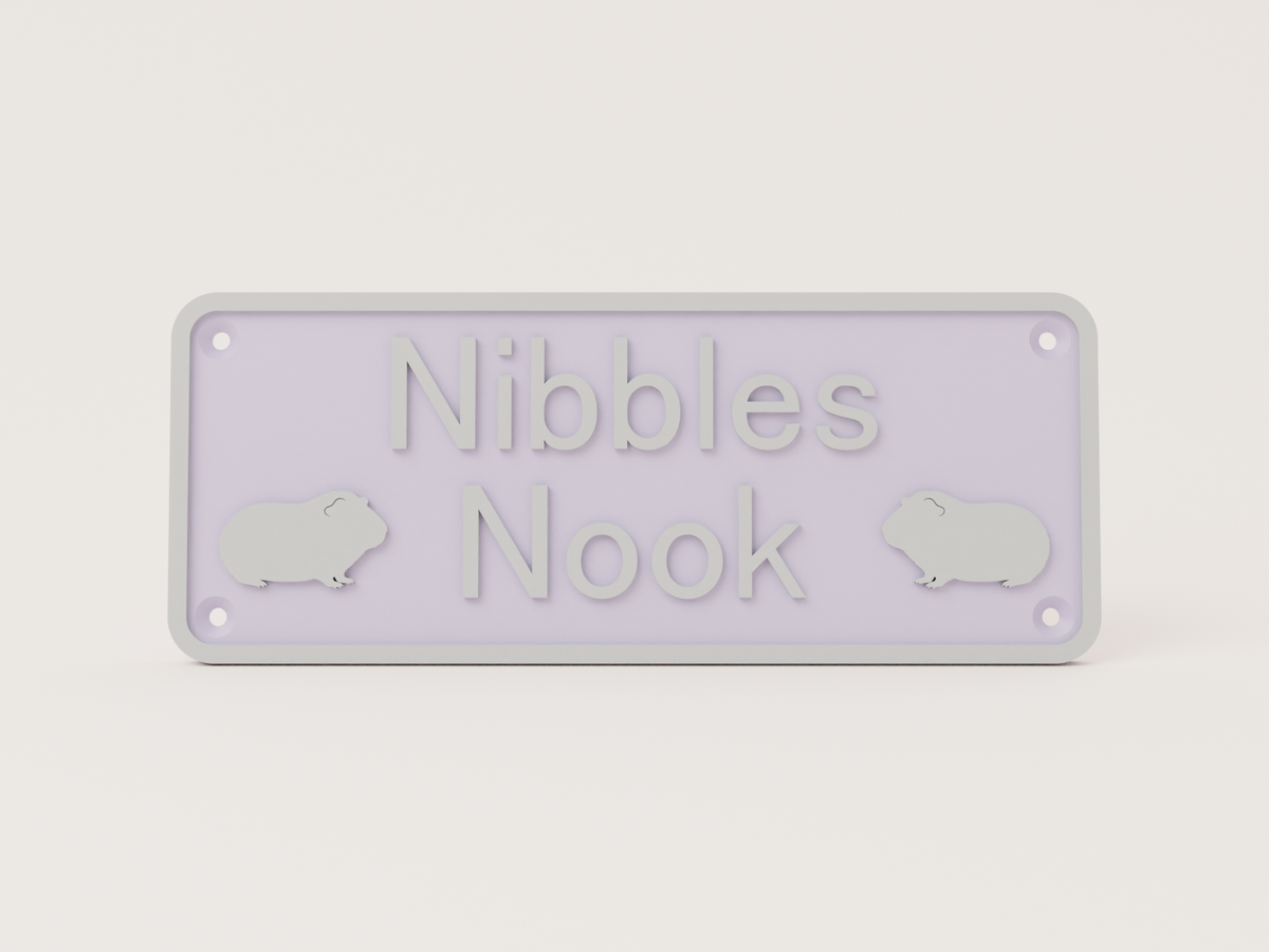 Lilac guinea pig house sign with silver lettering reading Nibbles Nook